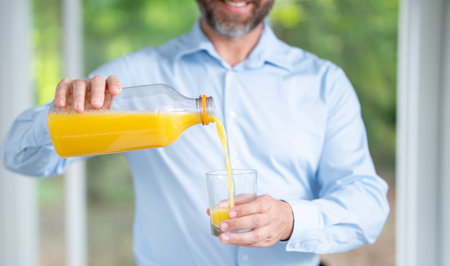 Healthy food concept. Healthy lifestyle. Man with fresh vegetables and fruits for a healthy meal. Man eats fresh salad with organic ingredients. Healthy kitchen.の写真素材