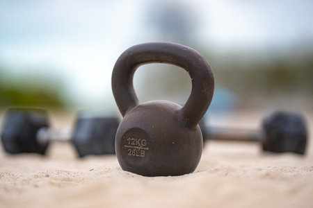 Kettlebell strength workout. Kettlebell training outdoors. Kettlebell exercise in the park....