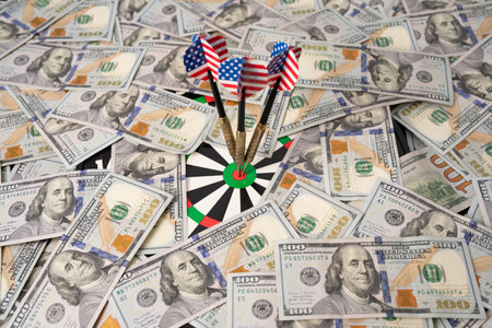 American money and dart hitting target. Money success with dollars and banknotes. American finance and money income concept. Credit, loan, and payment strategy with dollars money.の写真素材