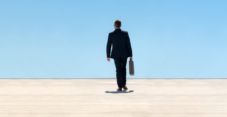 Back view of business man with briefcase walking. Business man walking away. Corporate leader go away. Man in suit with briefcase. Business professional from behind. Urban business man.の写真素材