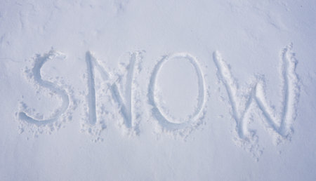 Winter text on snowy background. Snowy banner design in cold weather. Frosty winter text outdoors. Winter text with snowflakes. Snow background with winter text.の写真素材