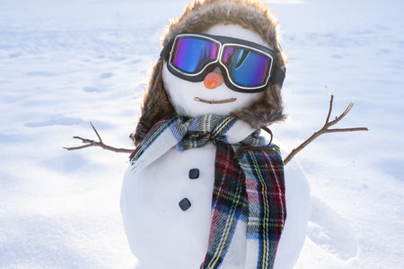 Snow man in frost. Snowman in winter banner design. Snowman with icy winter backdrop. Snowman festive design for postcard.の写真素材