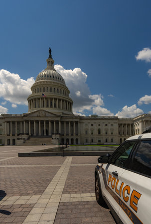 Police car in Washington DC. Police near Congress. Capitol Hill security. American police. Historic Capitol dome and police.の写真素材