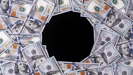 Money frame with dollars bills and copy space for text. US dollars currency banknotes. 100 USD notes forming a border for design. American dollars for copy space text. Cash and dollar bills design.の写真素材