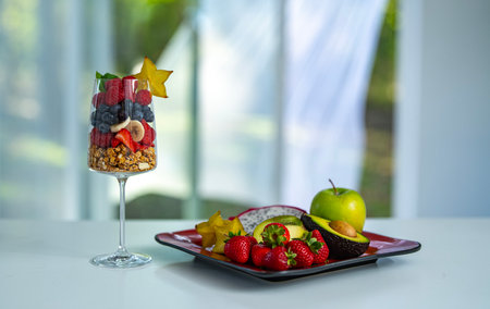 Fruit cocktail. Berries and fruits at kitchen. Morning snack. Natural breakfast. Fresh fruit blend with berries for breakfast.の写真素材