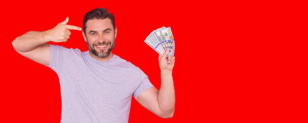 Business man with money banknotes. Male entrepreneur with dollar bills. Lucky boss, insurance agent, manager. Freelancer with cash. Mock up, for white banner with copy space.の写真素材