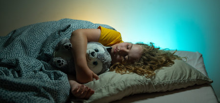 Child sleeping in a bed. Cute kid sleep. Kids pillow and blanket for sleeping. Little boy sleeps....