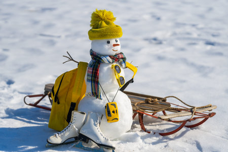 Snowman on festive greeting card for Christmas. Cute snowman on winter holiday card. Greeting card with snowman in snow. Snowman design on New Year celebration banner.の写真素材