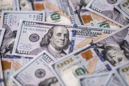 Money background with 100 dollars bills. Texture of US dollars. 100 USD banknotes in focus. American...