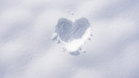Love symbol in snow. Romantic winter heart pattern. Love winter design for banner. Snowy heart template with snowflakes. Heart shaped in snow. Love winter.の写真素材