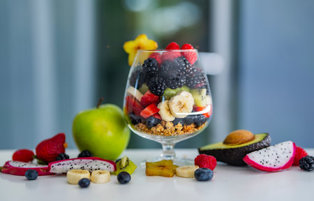 Morning Food with Fresh Fruits and Granola in Glass. Morning Breakfast with Fruits and Yogurt. Fresh Morning Food with Assorted Fruits and Natural Ingredients.の写真素材