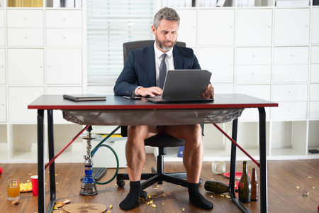Freelancer. Businessman in jacket and shorts on funny business meeting. Fun freelancer. Business man freelancer on business meeting in mess. Crazy workday. Free business.の写真素材