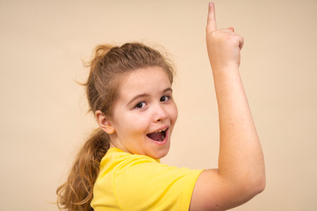 Excited child inspiration. Fun expression of sudden idea. Kid looks surprised. Child funny expression. Idea kids concept.の写真素材
