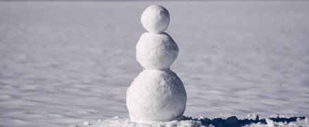 Snowman in frosty outdoor nature. Snowman in winter background for Christmas banner. Snowman in...