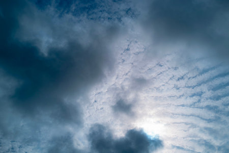 Sun on the puffy clouds. Sky view. Sunny sky. Background with clouds on blue sky. Clouds on sky.の写真素材