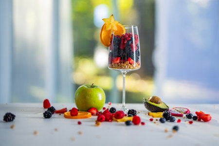 Healthy Fruits and Vitamins. Fresh Morning Meal with Granola Yogurt and Fruits. Organic Fruit Breakfast. Scene with Fruits Cocktail. Nutritious Morning Food with Superfoods and Natural Energy.の写真素材