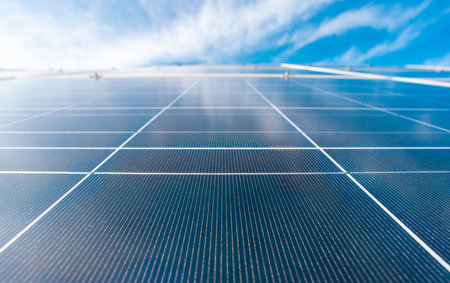 Panel panels on blue sky background. Solar solutions for green living. Power from solar is renewable. Solar panel and sun energy. Panel rows shine under the sun. Solar technology.の写真素材