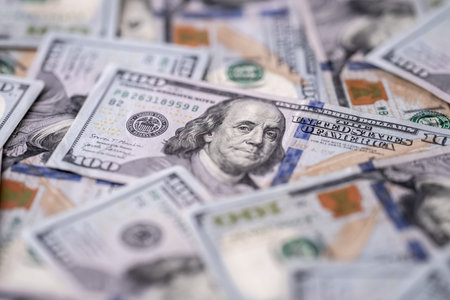 Money background with 100-dollar bills. Texture of US currency. 100 USD banknotes in focus. American...