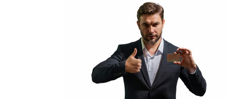 Business man holding a credit card on white isolated background. Hispanic man showing credit card. Credit or deposit bank card. Banner for header, copy space. Poster for web design.の写真素材