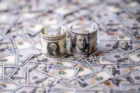 Money background with one-dollar and hundred-dollar bills. US currency and money concept. 1 USD and 100 USD notes. Finance and money concept. American dollars money pattern. Cash and savings.の写真素材