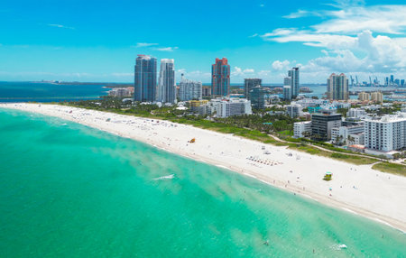 Top view of South Miami Beach and the ocean. Miami skyline with skyscrapers. Aerial view of Miami in summer. Miami shore with luxury buildings. Scenic drone view of Miamis famous coastline.の写真素材