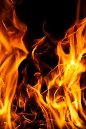 Fire flames on black backdrop. Fire texture. Blazing fire. Flame pattern. Intense burning fire...