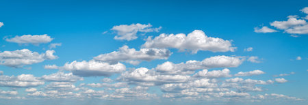 Clean sky with scattered clouds. Beautiful natural sky background. Bright and calm sky. Air sky with...