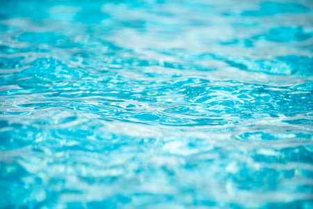 Ripped water in swimming pool. Surface of blue swimming pool, background of water.の写真素材