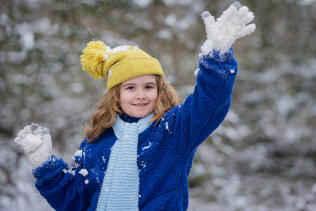 Winter season kids portrait. Kid winter face. Winter nature portrait of a child in cozy clothing. Winter clothing for teen kids.の写真素材