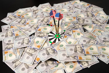 Dollars and target concept with dart hitting goal. Financial success with money and banknotes. Investment growth. American finance and income. Credit, loan, and payment strategy with USD.の写真素材
