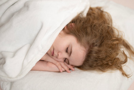 Kid sleep in comfort bed. Child face sleeping. Kid sleep at night. Child sleeping in deep rest. Kid...