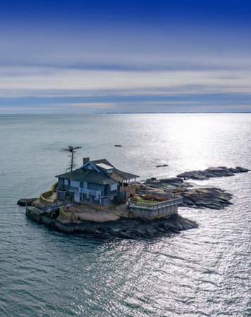 Island getaway with lonely house. Remote island house solitude. Castaway island house with no neighbors. Castaway house alone on quiet island.の写真素材
