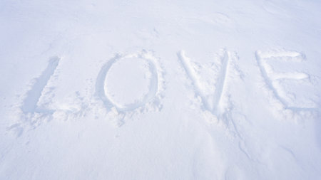 Winter heart. Love sign on snow. Snowy heart. Love shaped in snow. Snow heart design for winter banner.の写真素材