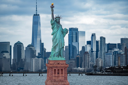 Independence Day banner. Manhattan skyline with the Statue of Liberty. Concept for freedom in the USA. NYC skyscrapers with the Statue of Liberty view. New York City cityscape on Statue of Liberty.の写真素材