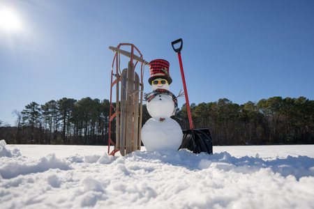 Snowman for winter card. Snowman with snowflake decoration. Snowman outdoors in winter festive.の写真素材