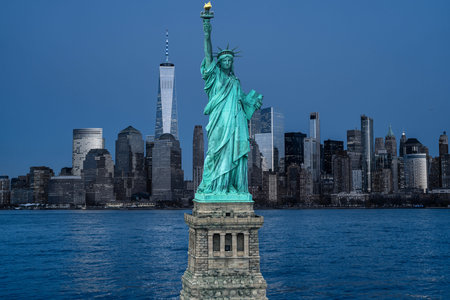 New York near Liberty Statue. Manhattan cityscape over Liberty Statue. NYC downtown towers and...