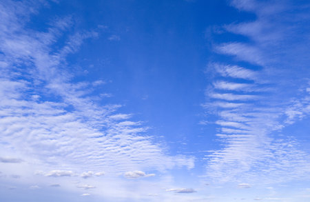 Tropical sky filled with white clouds. Calm and peaceful weather scene. Fluffy clouds drifting...