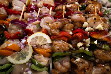 Fresh chicken looks juicy and marinated. Marinated chicken is ready for grilling outdoors. Quality chicken gives us tasty protein.の写真素材