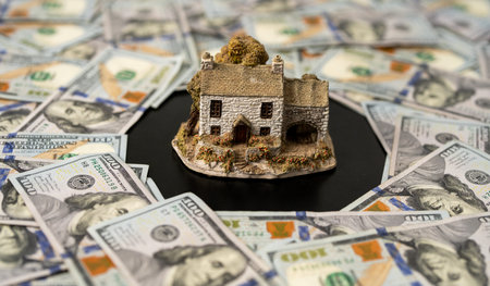 Real estate investment with house and property concept. Realtor and new home. Real estate business. Real estate market theme. Money for real estate savings.の写真素材