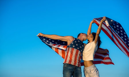 American couple love for freedom. American couple kiss for patriotism. American couple unity for...