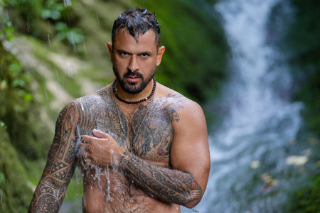 Healthy life strong man outdoors. Fit muscular male summer portrait. Wellness lifestyle man in nature. Athletic guy water splash. Healthy man. Fitness lifestyle. Healthy body. Man in nature.の写真素材