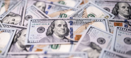 Money background with 100-dollar bills. Texture of US currency. 100 USD banknotes background....