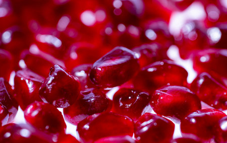 Red Background of pomegranate fruit. Ruby juicy pomegranate background. Pomegranate garnet fruit...