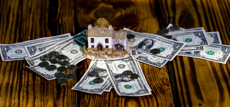 House purchase and mortgage concept with dollars. Real estate investment and property income....