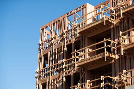 Construction shows wooden framework against blue sky. Construction residential building....
