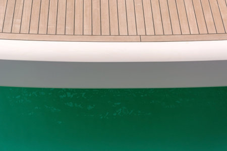 wooden deck of a yacht on sea backgroundの写真素材