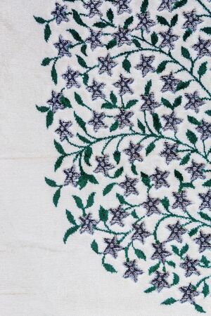 Fragment of colorful retro tapestry textile pattern with floral ornament useful as backgroundの写真素材