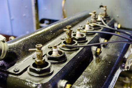 Spark plug in the old engine. Black engine.の写真素材