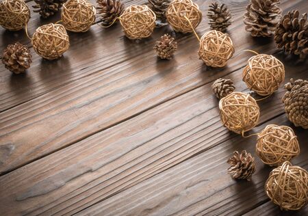 Rustic wood background with pine cones. Dark brown colors.の写真素材