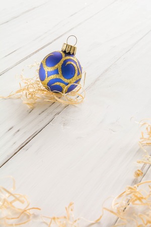 bright toys for Christmas tree and interior design, on white wooden background. Vertical comhosition,の写真素材